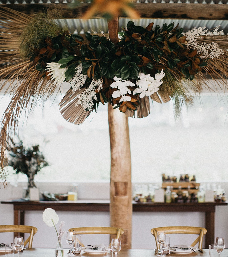 Floral installation above a wedding table.